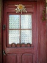 Detail old door with window and flower of the sun, Eguzkilore Royalty Free Stock Photo