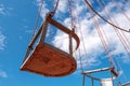 Detail of the old fashioned carousel with cloudy blue sky background