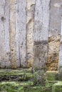 Detail of an old half-timbered house with dirty walls and weathered wood,damaged, bottom wall , abstact photo France