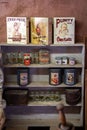 old kitchen pantry shelf with packaged products, cereals and spices.