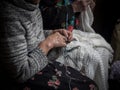 Detail of an old lady knitting Royalty Free Stock Photo