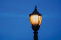 Detail of an old light post at nightfall