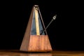 Detail of an old mechanic musical metronome