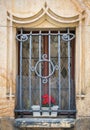 Detail with an old medieval window with metal security iran bars Royalty Free Stock Photo