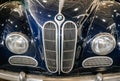 Detail of old mythic german car with radiator grille and round light