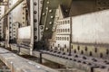 Detail of old rail bridge, large nuts, bolts and rivets visible. Abstract industrial background Royalty Free Stock Photo