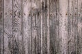 Detail of old rustic wooden planks wall with scraps of pink flacking paint, grunge texture Royalty Free Stock Photo