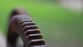 Detail of old rusty gears transmission wheels on green background Royalty Free Stock Photo