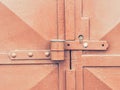 Detail of rusty metal lock latch on the old door. Old fashion door gate Royalty Free Stock Photo