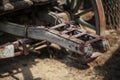 Detail on old rusty wooden wagon connecting mechanism.