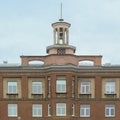 Detail of an old soviet office building with little clock tower