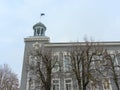 Detail of an old soviet office building with little clock tower