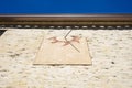 Detail of old sundial on a sunny day in a mediterranean country Royalty Free Stock Photo