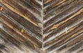 Detail of old unpainted wooden door with diagonal slats. Royalty Free Stock Photo