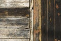 Detail of old unpainted wooden door with horizontal and vertical slats and. Royalty Free Stock Photo