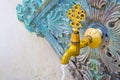 Detail of a old water Turkish brass faucet with drinking water running down used to wash before entering a mosque Royalty Free Stock Photo