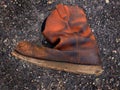 Old Worn Leather Boot Abandoned on Road Royalty Free Stock Photo