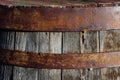 Detail of an old wine barrel made of old wood with rusty rings around it Royalty Free Stock Photo