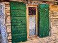 Detail of Old Wooden Building With Green Window Shutters Royalty Free Stock Photo