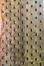 Detail from old wooden door with ancient metal rivets
