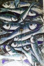 Detail old wooden door decorated with a painting of fishs. Royalty Free Stock Photo