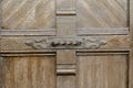 Detail old wooden door with forged iron ornament.