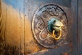 Detail of wooden door with metal handle Royalty Free Stock Photo