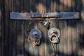 The detail of the old wooden door with the metal knockers on it. Royalty Free Stock Photo