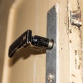 Detail of an old wooden door with rusty handle Royalty Free Stock Photo