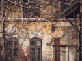 Detail with an old worn out building. Plaster peeling from an old brick wall in Bucharest, Romania Royalty Free Stock Photo