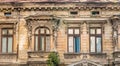 Detail with an old worn out building. Old vintage architecture in Bucharest, Romania Royalty Free Stock Photo