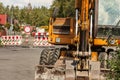 Detail on old yellow digger machine back, driver cabin visible Royalty Free Stock Photo