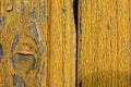 Detail from old yellow painted, wooden doors Royalty Free Stock Photo