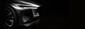 Detail of the one LED headlights car on black background Royalty Free Stock Photo