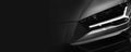 Detail of the one LED headlights super car on black background Royalty Free Stock Photo