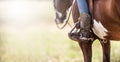 Detail of a ornamented cowboy boots in a stirrup while sitting on a horse Royalty Free Stock Photo