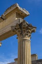 Detail of the ornate marble column moldings and Corinthian style capital of the well-preserved Roman Temple of Diana under a clear