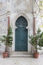 Detail of an ornate Victorian brick archway and wooden door a church. Royalty Free Stock Photo