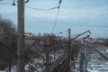 Detail of overhead lines and industrial railway landscape in train station Royalty Free Stock Photo