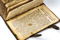 Detail of page with historical text on open old book Royalty Free Stock Photo