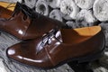 Detail of a pair of brown luxurious men's leather shoes.