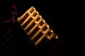 Detail of a pan flute on a black background Royalty Free Stock Photo