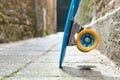 Detail of parked penny board in an alley