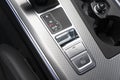 Detail of a parking brake in a nodern car. Electronic parking brake button in a modern car. Button closeup Royalty Free Stock Photo