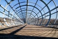 Detail of a pedestrian suspension wooden and steel footbridge Royalty Free Stock Photo