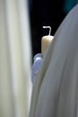 Detail penitent white holding a candle