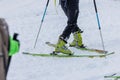 Detail of a person performing a 180 degree turn while ski touring or mountaineering. Person making a turn on skis walking uphill Royalty Free Stock Photo