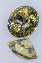 Detail photo focus stacking of a self-cut Cubic Zirconia with Lemon color and Round Brilliant Portuguese cut, placed on a mirror Royalty Free Stock Photo