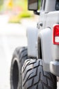 Detail photo of a tough off road vehicle with oversized big tires Royalty Free Stock Photo