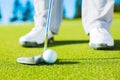 Detail Photograph of Man Putting Golf Ball into the Hole Royalty Free Stock Photo